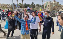 Watch: Hundreds join Purim parade in Hebron