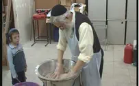 Beit El's Rabbi Melamed Actively Participates in Matzah Baking