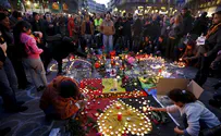 Watch: Belgians protect Israeli flag at Brussels memorial