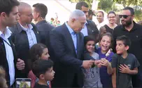 Watch: Netanyahu makes surprise visit at Lag Ba'Omer bonfire