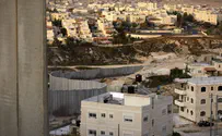 Floods cause Jerusalem security fence to collapse