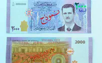 Assad portrait featured on new banknote