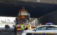 Miracle as truck crane collides with bridge