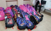 Needy students receive brand-new backpacks