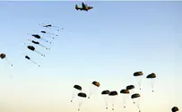 Near-disaster as paratroopers jump over underflying plane