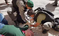 Palestinian man faints, Israeli Border Police come to his aid