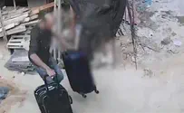 Watch: Man breaks into apartment, fills suitcases, and flees