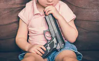Israeil-Arab baby filmed playing with loaded gun