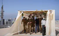 Watch: Building a Sukkah on top of IDF headquarters