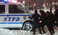 Watch: Chabad Jews help snow-stuck NYPD vehicle
