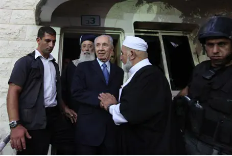 President Peres visits damaged mosque