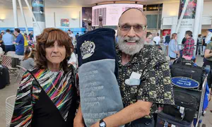 Rabbi and his wife make aliyah with pre-WWII Torah from Poland