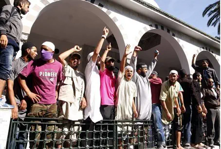 Tunisian Salafists shout slogans outside the 