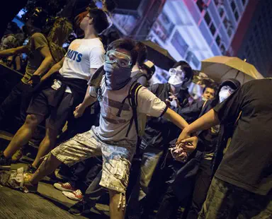 Watch: Police in China use water cannons, beat protesters