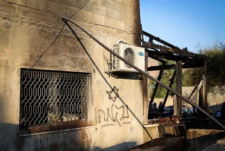 Graffiti at Duma arson site