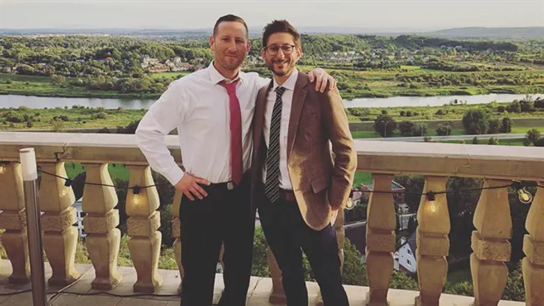 Danny Fenster, right, with his brother Bryan at a friend's wedding in Krakow, Poland