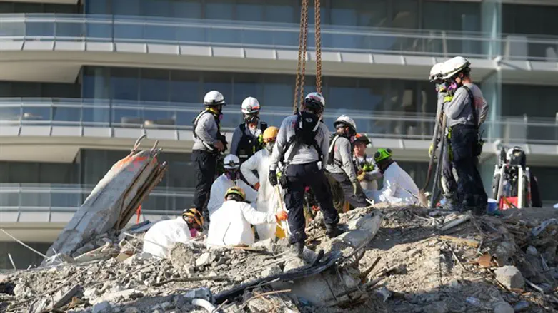 Search and rescue personnel work at the site of Surfside collapse