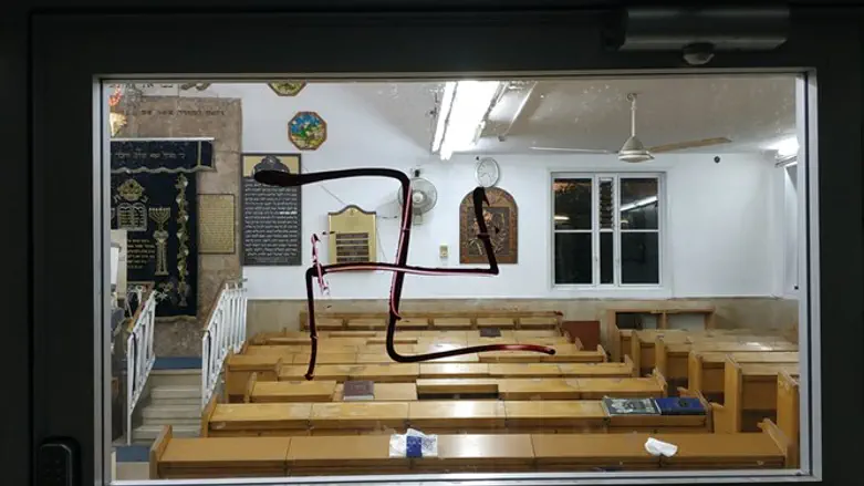 Swastikas on the synagogue's door