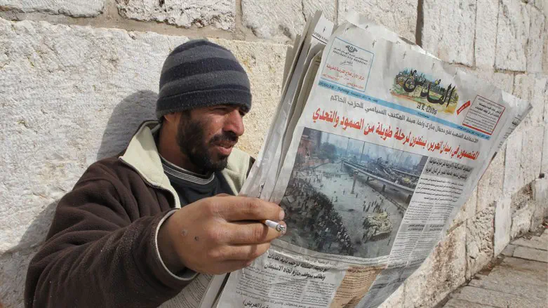 Arab reading newspaper, Old City, Jerusalem