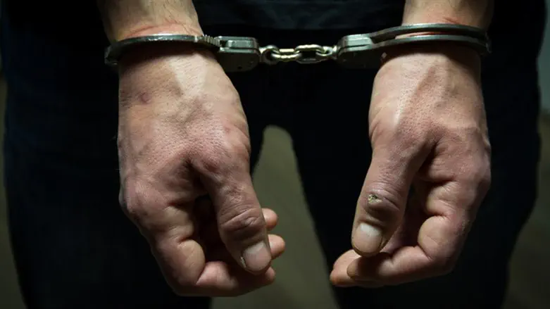 Handcuffs on suspect (illustrative)
