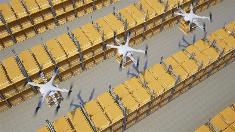 Drones with boxes fly above warehouse