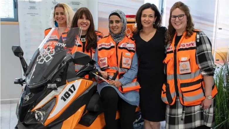 Sheryl Sandberg, second from right, poses with members of United Hatzalah