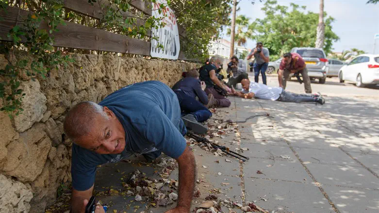 Ashkelon residents take cover from incoming rockets during Operation Guardian of the Walls