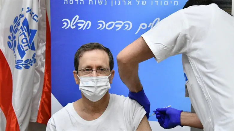 President Isaac Herzog receives his second booster shot