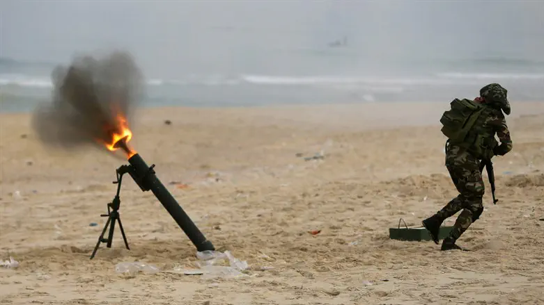 Gaza terrorists firing a rocket into Israel