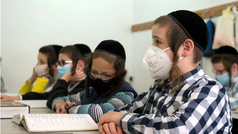 Haredi students wear face masks