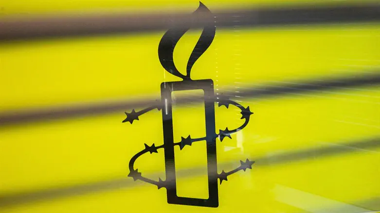 The Amnesty International logo is seen in their office in Hong Kong, October 202
