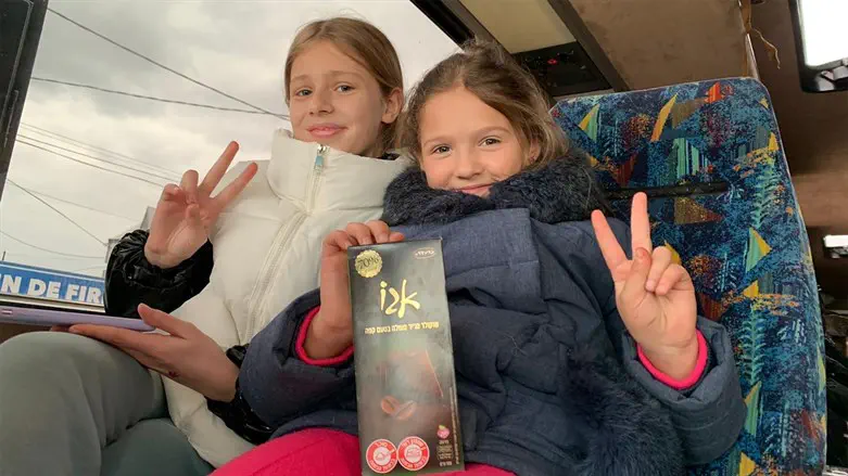 Two Ukrainian-Jewish girls shown on a bus in Moldova arranged for their families