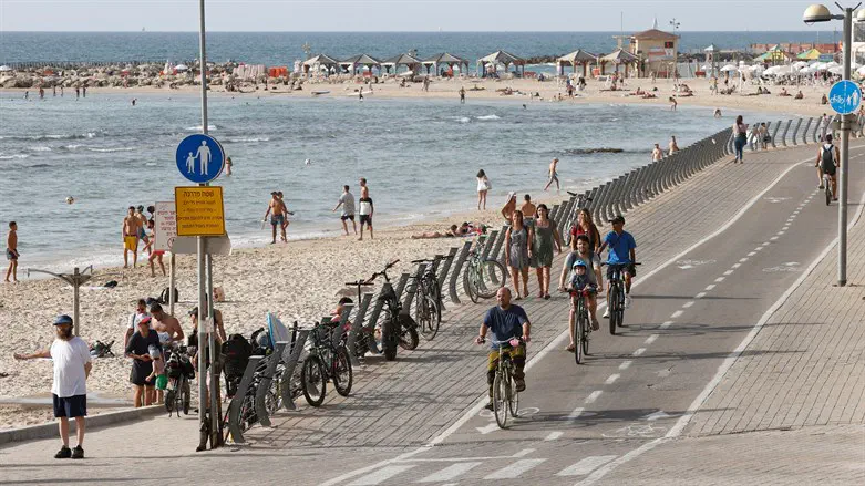 People gather on a seaside promenade in Tel Aviv, May 6, 2021.