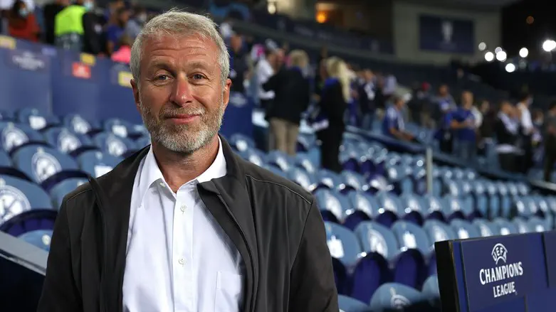 Roman Abramovich smiles following the team's victory during the UEFA Champions League