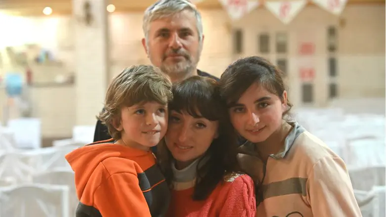 Ruslan and Karina Baikov pose with their children, Artium and Sonia