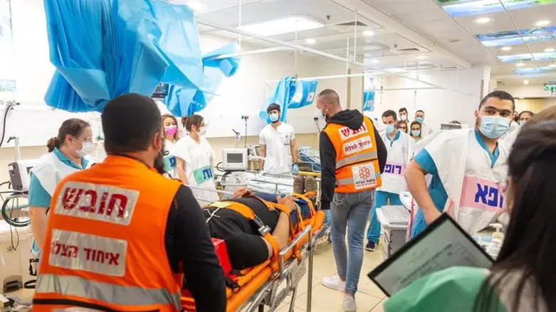 United Hatzalah volunteers bring a patient to the hospital