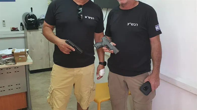 Local security coordinators with their weapons