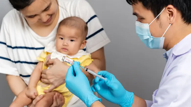 Asian infant receives COVID-19 vaccine