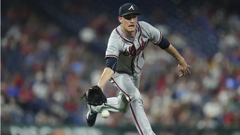 Max Fried of Atlanta Braves flips ball to force out Johan Camargo of Philadelphia Phillies