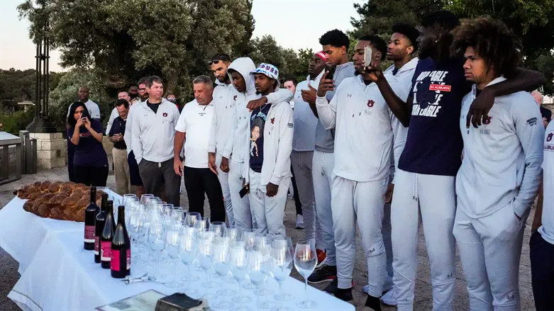 The Auburn University men's basketball team celebrating Shabbat in Israel, July 