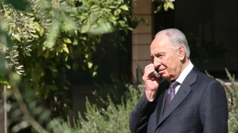President Shimon Peres on cell phone