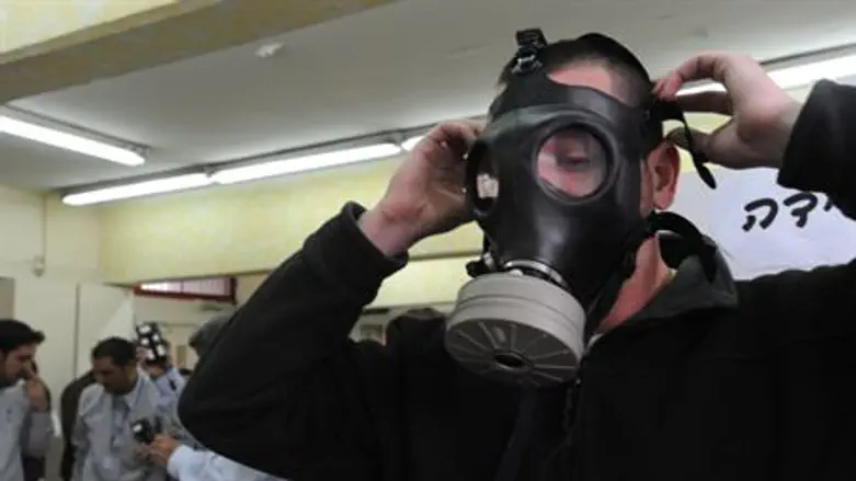 Man tries on gas mask