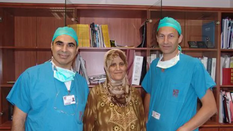 Rambam doctors with the patient they saved