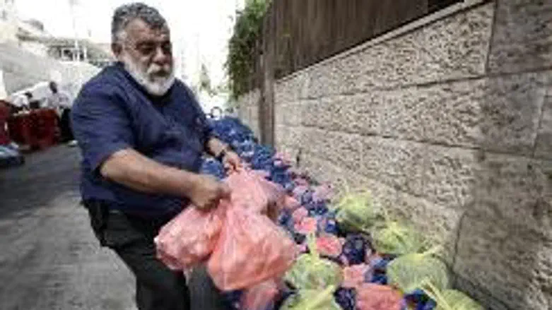 Volunteer prepares food for the needy