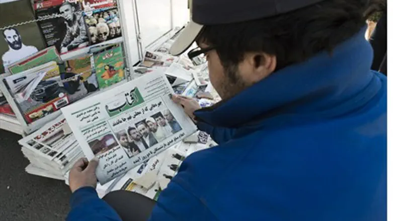 Checking the Sunday headlines in Tehran