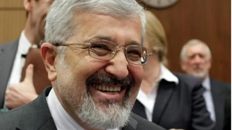 Iran's IAEA envoy Ali Asghar Soltanieh smiles