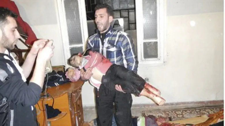 Man Carrying Body of Child in Homs, 12 March 