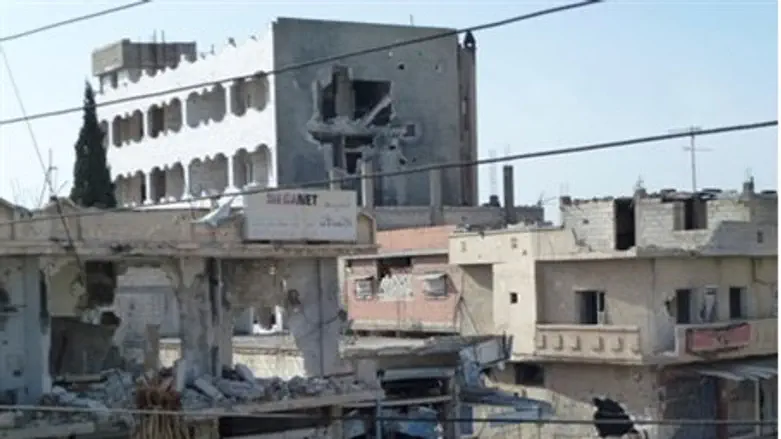 Buildings hit by government forces near Homs 