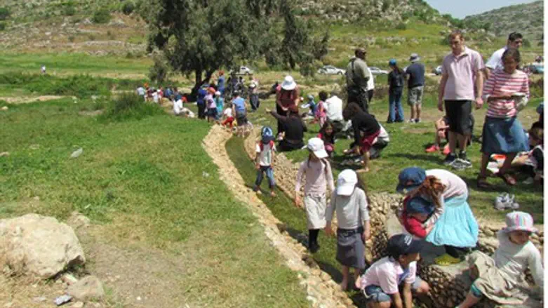 Visitors hike in Samaria