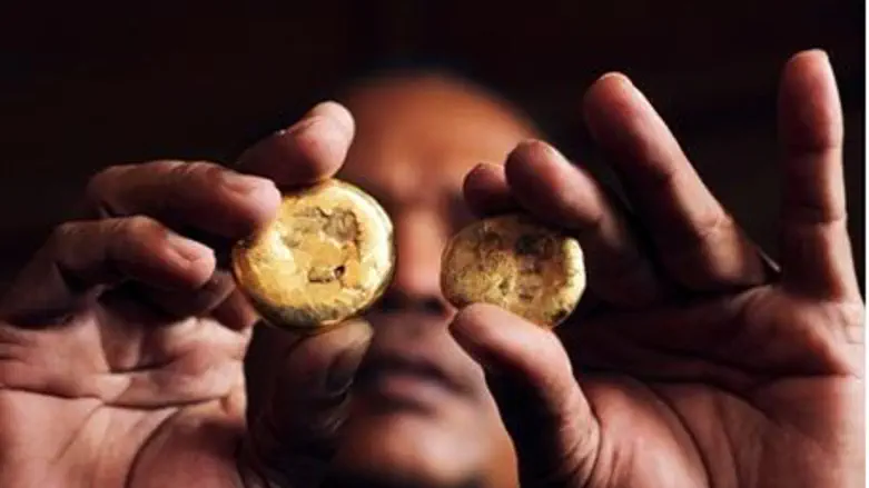  A local gold trader shows two pieces of gold